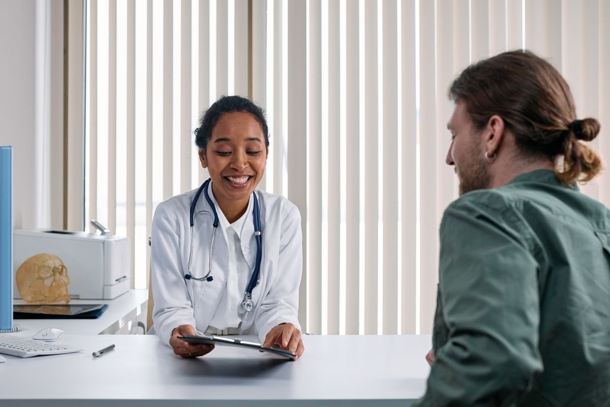 A healthcare professional in conversation with a patient